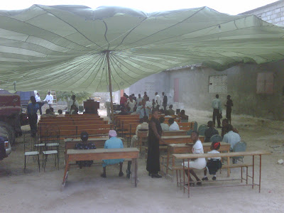 Church service under parachute tent in Haiti after earthquake